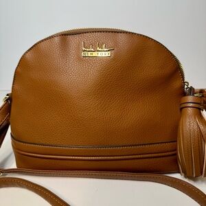 EUC. Nicole Miller tan Butterscotch color crossbody bag.